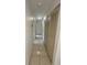 Hallway with tile flooring provides easy access to all of the rooms in the home at 5315 Malamin Rd, North Port, FL 34287