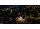 Aerial night view of home's pool and neighborhood near a canal, showcasing location and property features at 540 S Polk Dr, Sarasota, FL 34236