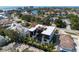Aerial view of a modern home with a rooftop deck, pool, and close proximity to the water and beach at 540 S Polk Dr, Sarasota, FL 34236