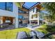 Luxury home with a backyard featuring an artificial lawn, pool, lounge chairs, and an outdoor entertainment area at 540 S Polk Dr, Sarasota, FL 34236