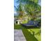 Well-manicured lawn area with stylish lounge chairs, perfect for relaxation under the palms at 540 S Polk Dr, Sarasota, FL 34236