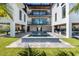 A backyard showcasing an artificial lawn, pool, and outdoor entertainment area perfect for relaxing and entertaining guests at 540 S Polk Dr, Sarasota, FL 34236