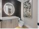 Contemporary powder room featuring stylish mirror, modern vanity, and decorative wall art at 540 S Polk Dr, Sarasota, FL 34236