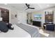 Inviting bedroom features a large window, ceiling fan, and a view of outdoor greenery at 540 S Polk Dr, Sarasota, FL 34236
