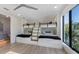 Unique bunk beds with black metal rails and a view of the outdoors from a large window at 540 S Polk Dr, Sarasota, FL 34236