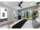 Comfortable bedroom featuring an attractive ceiling fan, and expansive windows offering ample natural light and outdoor views at 540 S Polk Dr, Sarasota, FL 34236