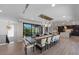 Open concept dining room with a large dining table and modern chandelier lighting at 540 S Polk Dr, Sarasota, FL 34236