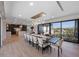 Open concept dining room with a large dining table and modern chandelier lighting at 540 S Polk Dr, Sarasota, FL 34236
