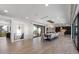 Bright dining room with modern chandelier and views to the outside balcony and kitchen area at 540 S Polk Dr, Sarasota, FL 34236