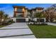 Striking modern home featuring clean lines, mixed materials, balconies, and a well-manicured lawn at 540 S Polk Dr, Sarasota, FL 34236