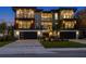 Modern home exterior showcasing clean lines, well-manicured landscaping, dual garages, and ample outdoor balconies at 540 S Polk Dr, Sarasota, FL 34236