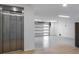 Spacious garage with an elevator, bright lighting, and ample room for parking and storage at 540 S Polk Dr, Sarasota, FL 34236