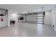 Clean, spacious garage with ample lighting and storage, offering plenty of room for vehicles and beach equipment at 540 S Polk Dr, Sarasota, FL 34236