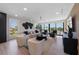Bright and airy living room with large windows offering stunning views and modern coastal decor at 540 S Polk Dr, Sarasota, FL 34236
