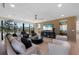Living room with stylish decor, wood paneling, and large windows offering stunning city views at 540 S Polk Dr, Sarasota, FL 34236
