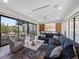 Stylish living room featuring comfortable seating, a large window with outdoor views, and a modern entertainment setup at 540 S Polk Dr, Sarasota, FL 34236