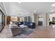 Bright and spacious living room with an elevator, comfortable seating, hardwood floors, and ample natural light at 540 S Polk Dr, Sarasota, FL 34236