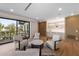 Bright living room with a bar area, hardwood floors, recessed lighting, and a balcony access with seating at 540 S Polk Dr, Sarasota, FL 34236