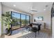 Bright office space featuring a desk, chairs, and a large window with beautiful outdoor views at 540 S Polk Dr, Sarasota, FL 34236