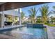 Inviting backyard with a pool featuring elegant water features and a covered seating area at 540 S Polk Dr, Sarasota, FL 34236