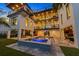 A spacious pool and patio area featuring modern design, multiple balconies, and outdoor entertainment possibilities at 540 S Polk Dr, Sarasota, FL 34236