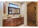 Bathroom featuring dual vessel sinks, granite countertops and a walk-in shower at 5624 Aaron Ct, Sarasota, FL 34232