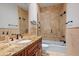 Updated bathroom with granite countertops, an undermount sink, and a tiled shower and tub at 5624 Aaron Ct, Sarasota, FL 34232