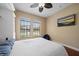 Bedroom featuring built-in shelving, a bed, and natural light from the two windows at 5624 Aaron Ct, Sarasota, FL 34232
