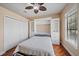 This bedroom features built-in shelving, closet, hardwood floors, and natural light at 5624 Aaron Ct, Sarasota, FL 34232