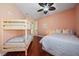 Bedroom featuring bunk beds, a double bed, and dark wood floors creating a comfortable living space at 5624 Aaron Ct, Sarasota, FL 34232
