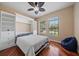 Bedroom with a full bed, built-in shelving, ample natural light, and a comfortable beanbag chair at 5624 Aaron Ct, Sarasota, FL 34232