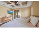 Bright bedroom with decorative ceiling fan and access to outdoor living space at 5624 Aaron Ct, Sarasota, FL 34232