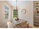 Cozy dining area with natural light, chandelier, and table at 5624 Aaron Ct, Sarasota, FL 34232