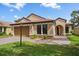 Charming single-story home with a tile roof, lush landscaping, and a welcoming front entrance at 5624 Aaron Ct, Sarasota, FL 34232
