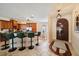 Stylish kitchen with stainless steel appliances, barstool seating, and elegant lighting at 5624 Aaron Ct, Sarasota, FL 34232