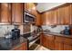 Close-up of gourmet kitchen featuring stainless steel appliances and backsplash detail at 5624 Aaron Ct, Sarasota, FL 34232
