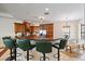 Kitchen island with granite countertop and bar seating adjacent to dining area at 5624 Aaron Ct, Sarasota, FL 34232