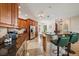 Open kitchen featuring granite counters, bar seating, and tile floors at 5624 Aaron Ct, Sarasota, FL 34232
