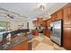 Spacious kitchen featuring stainless steel appliances, granite countertops and tile floors at 5624 Aaron Ct, Sarasota, FL 34232