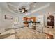 Open-concept living room with coffered ceiling, views of the kitchen, and comfortable seating at 5624 Aaron Ct, Sarasota, FL 34232