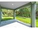 Covered back porch providing an outdoor relaxation area at 5672 Jonesboro Ave, North Port, FL 34288