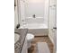 Clean bathroom boasts a tub with shower, granite counter, and tile flooring at 5672 Jonesboro Ave, North Port, FL 34288