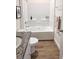 Clean bathroom boasts a tub with shower, granite counter, and tile flooring at 5672 Jonesboro Ave, North Port, FL 34288