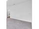 Spacious bedroom with neutral carpet, a closet, and an ensuite bathroom featuring natural light at 5672 Jonesboro Ave, North Port, FL 34288