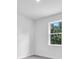 Bright bedroom featuring a large window with natural light at 5672 Jonesboro Ave, North Port, FL 34288
