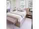 Modern bedroom with light wood furnishings and minimalistic decor creating a calming atmosphere at 5672 Jonesboro Ave, North Port, FL 34288