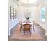 Cozy dining room with modern wood furniture, stylish decor, and lots of natural light at 5672 Jonesboro Ave, North Port, FL 34288
