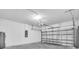 Spacious two car garage with white walls and plenty of room for storage at 5672 Jonesboro Ave, North Port, FL 34288