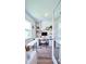 Well-lit home office with built-in shelving, an expansive work surface, and a comfortable rolling chair at 5672 Jonesboro Ave, North Port, FL 34288