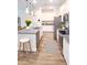 Modern kitchen features stainless steel appliances, granite countertops, and an island with bar stool seating at 5672 Jonesboro Ave, North Port, FL 34288